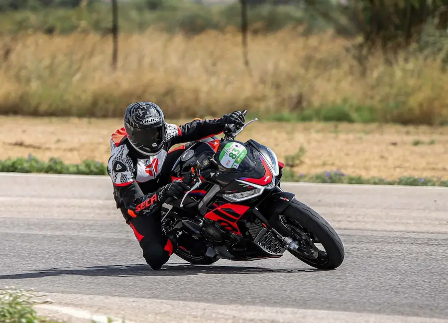Alex Moudatsos riding his motorcycle at the track.