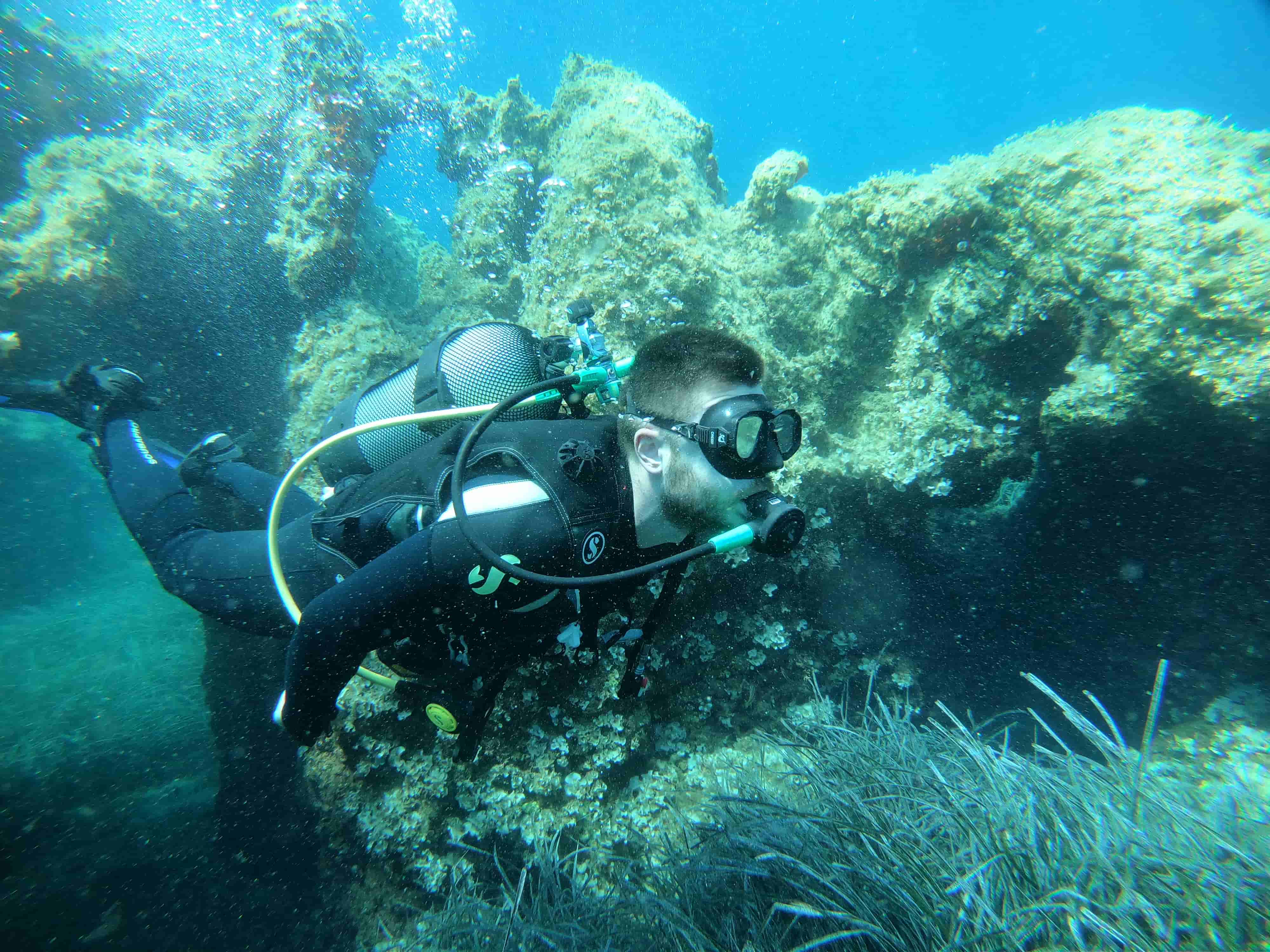 Alex Moudatsos underwater during a SCUBA dive
